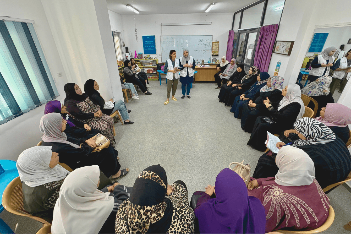 Women sit in a circle during a stop the bleed training in Tulkarem, West Bank.